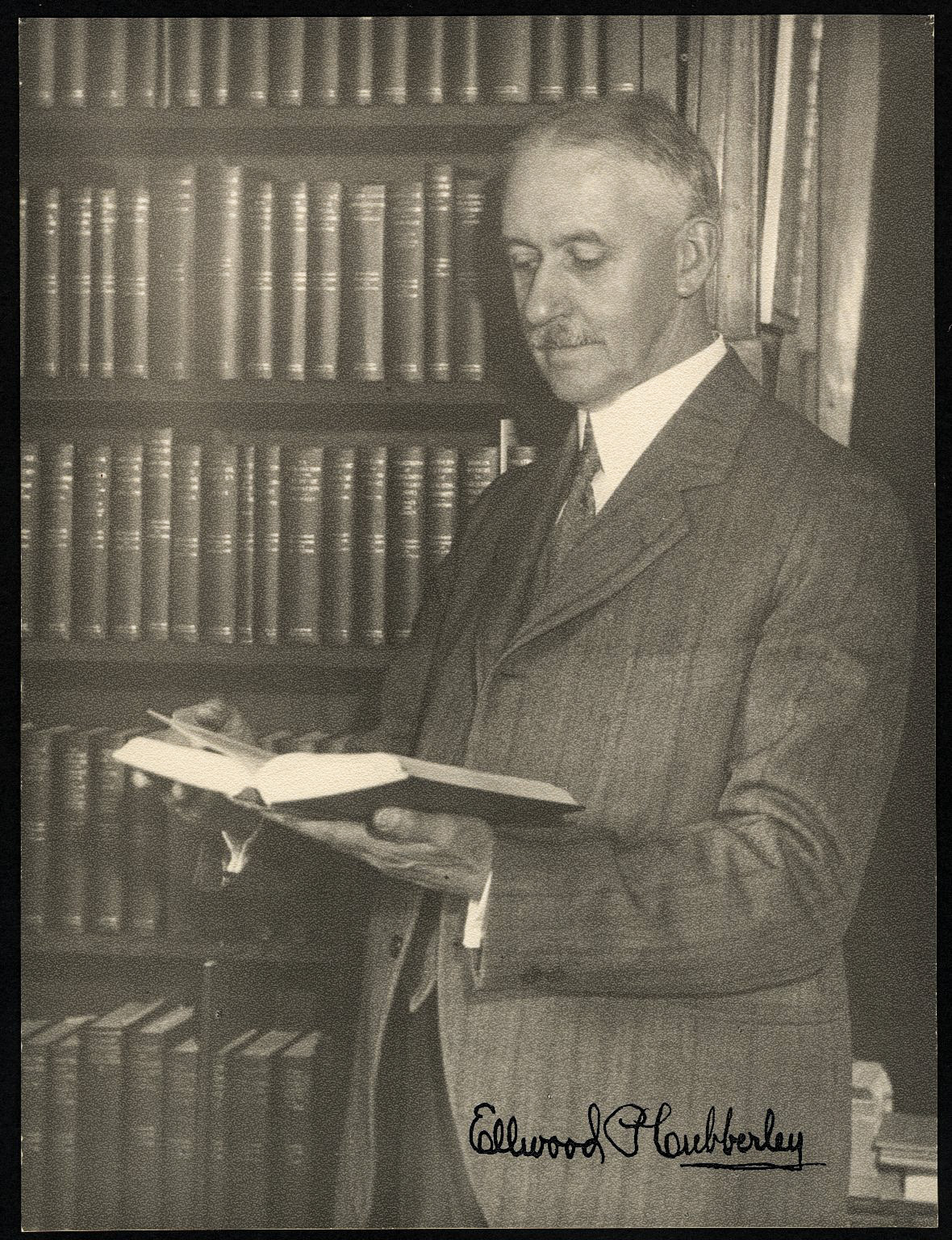 Ellwood P. Cubberley with titles in the Riverside Textbooks in Education series he wrote and edited.Stanford University Archives