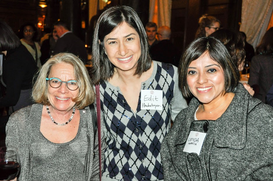 Three woman posing for a photo.